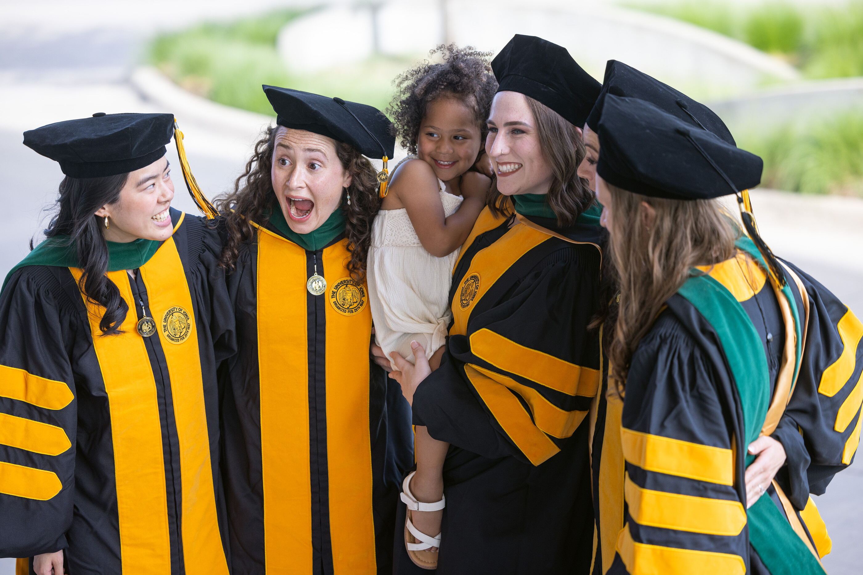 MD Commencement graduates smile in a group photo.