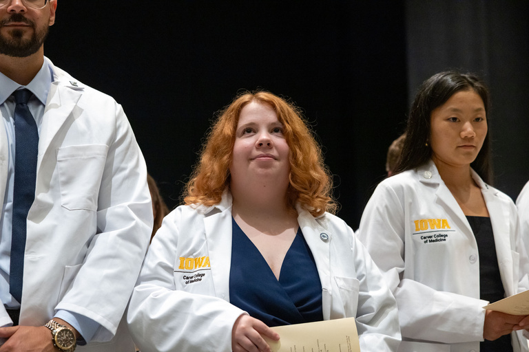 Carver College of Medicine first-year medical students receive their white coats during the White Coat Ceremony at Hancher Auditorium on Friday, Aug. 16, 2024.