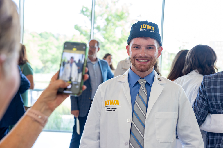 Carver College of Medicine first-year medical students receive their white coats during the White Coat Ceremony at Hancher Auditorium on Friday, Aug. 16, 2024.