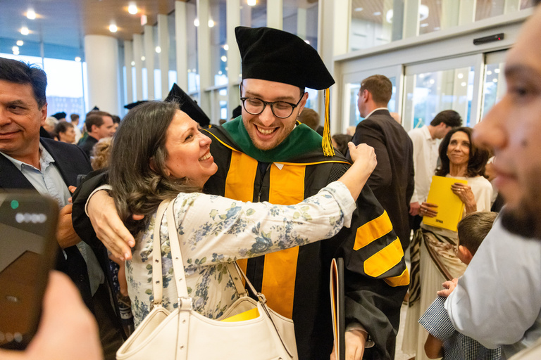 MD graduate celebrates the MD commencement ceremony.