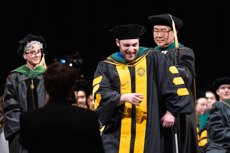 MD graduate at the MD commencement ceremony.