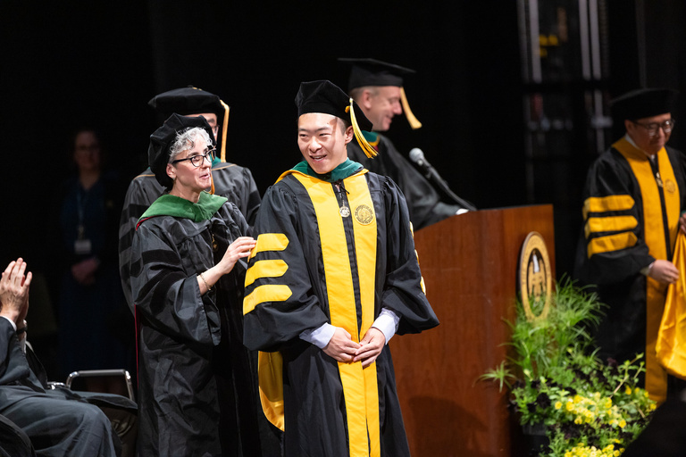 Carver College of Medicine MD program commencement graduate.