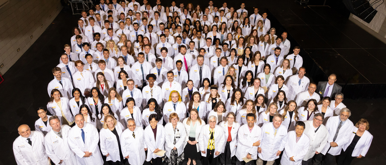 Carver College of Medicine first-year medical students receive their white coats during the White Coat Ceremony at Hancher Auditorium on Friday, Aug. 16, 2024.