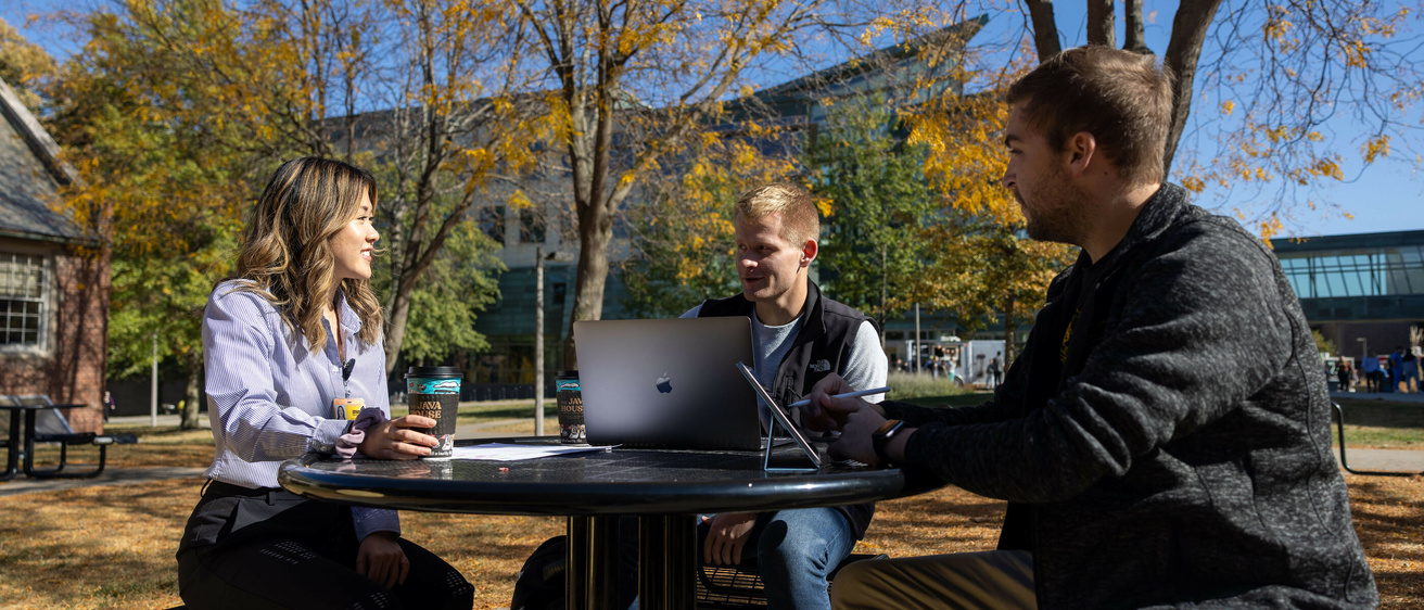 Medical students Michelle Chen, Harrison Parker, Spenser Larson on the Carver College of Medicine campus with fall foliage on Thursday, Oct. 24, 2024.