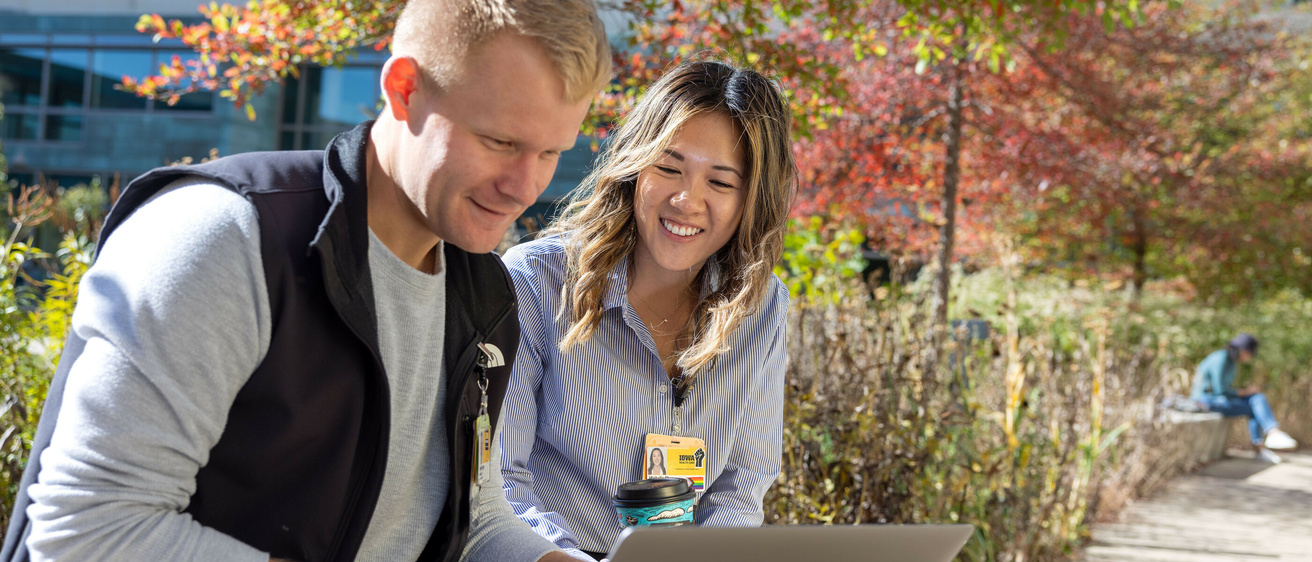 Medical students Michelle Chen, Harrison Parker, Spenser Larson on the Carver College of Medicine campus with fall foliage on Thursday, Oct. 24, 2024.